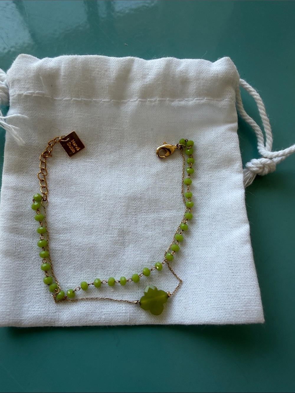 Gold-Tone Bracelet with Light Green Beads and Clover Charm